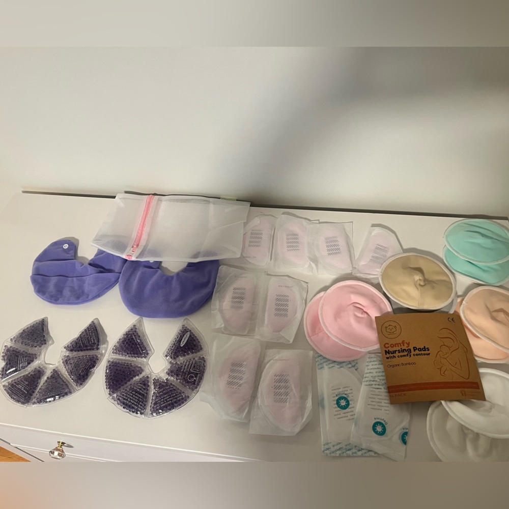 Never used! Nursing pads and warmer